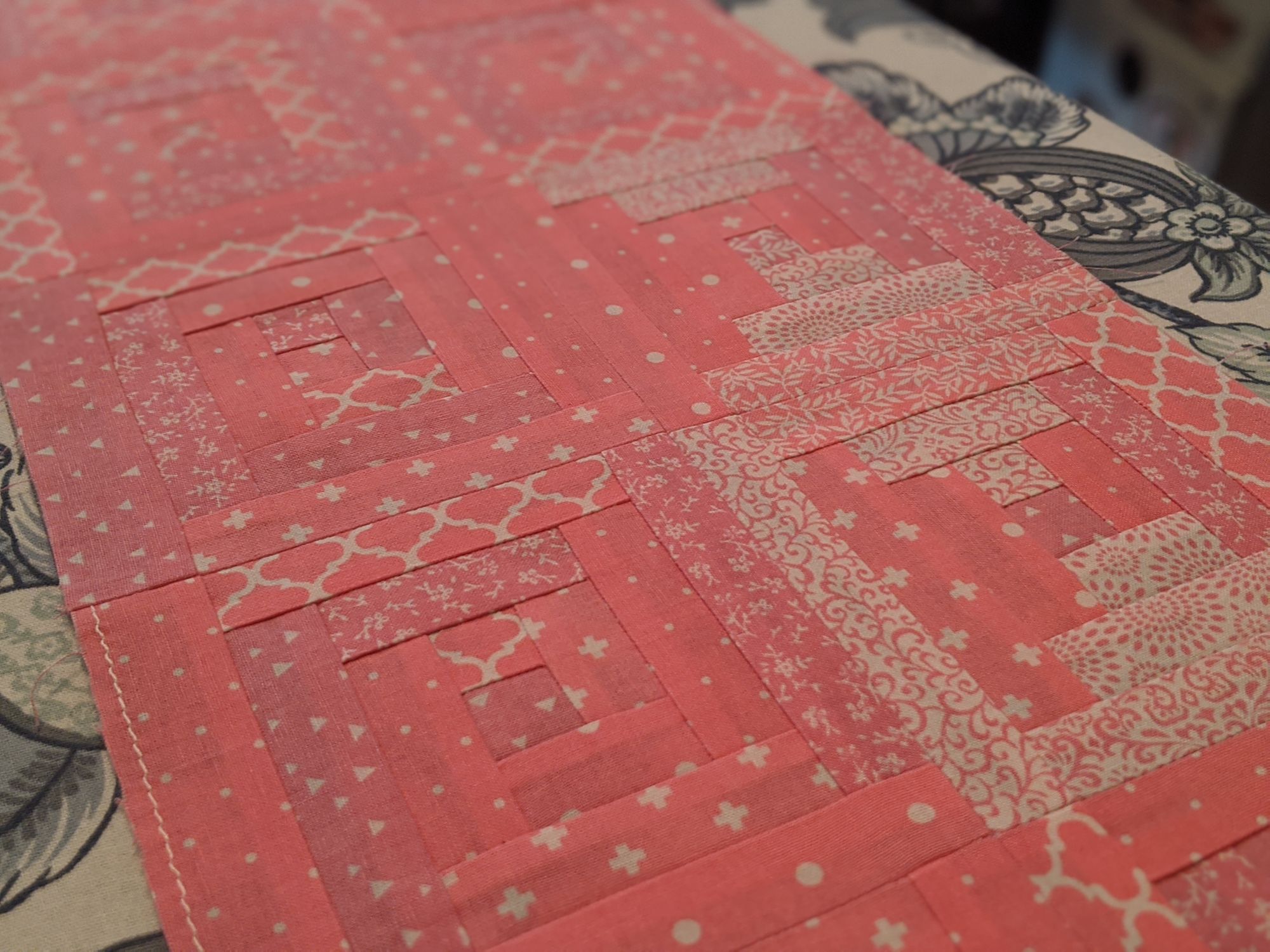 Log cabin quilt for a newborn girl